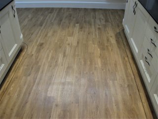 Amtico Spacia (colour Royal Oak) with Curved feature border. Amtico LVT