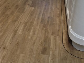Amtico Spacia (colour Royal Oak) with Curved feature border. Amtico LVT