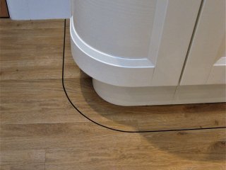 Amtico Spacia (Royal Oak) with custom curve pinstripe inset Amtico Spacia LVT with custom border